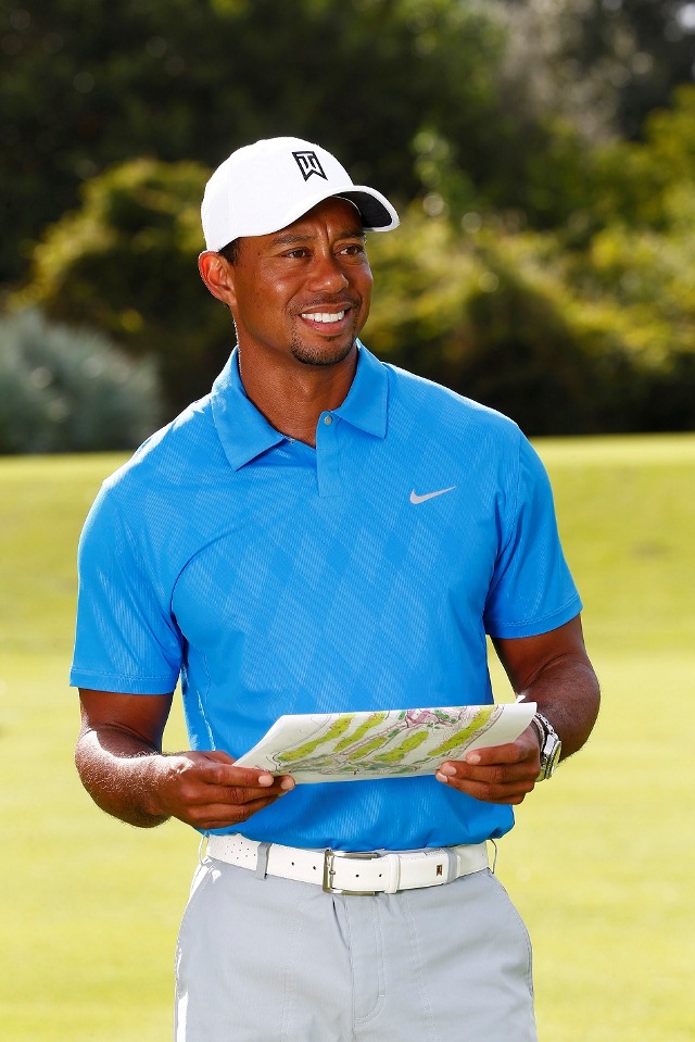 Tiger Woods looking left blue shirt